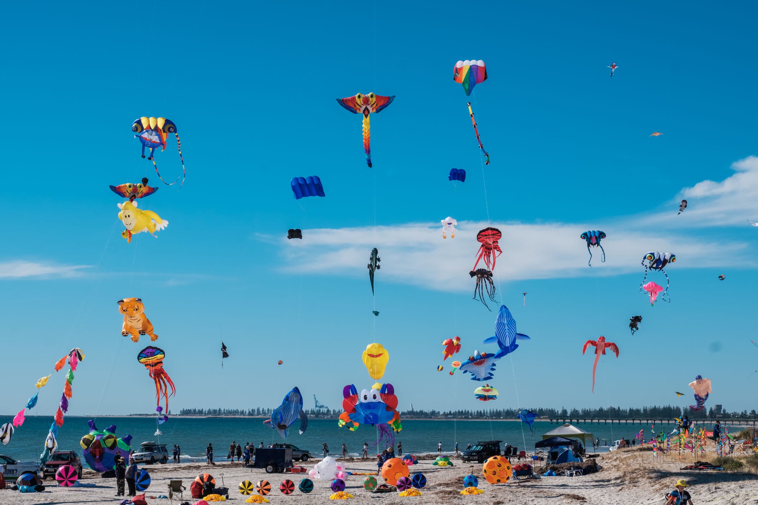 Adelaide, Australia - March 31, 2018: Adelaide International Kite Festival at Semaphore Beach viewed from jetty. Event gathered together kite flyers from Australia, New Zealand, USA and Japan
